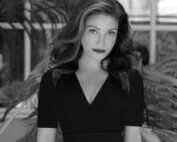 A headshot of a woman in black and white.